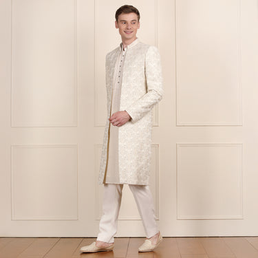 Regal Cream Sherwani with Golden Zari Work – Royal Ensemble