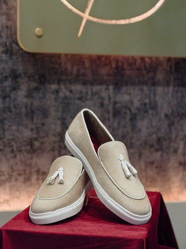 SUEDE TASSLE SLIP-ONS